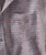 And Then Again, product image showing a close-up of a men's shirt pocket with a striped pattern and button details.