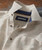 On The Dot, men's casual button-up shirt with a multicolored dotted pattern and a contrasting navy inner collar.