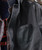 Can I Get It? Black and Gray Jacket, close-up image showing the chest pocket and textured fabric design.