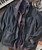 Can I Get It?, Casual men's jacket layered over a graphic t-shirt, with a piano keyboard and vintage lamp in the background.