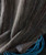 Space Is The Place, fabric with multicolored thin vertical stripes draped over a blue plastic cable reel.