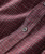 Do Your Own Thing, close-up of a red checkered fabric shirt with detailed stitching and a button.