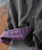 Whatever It Takes, close-up of a fabric sleeve with a purple cuff and black-and-white checkered pattern fabric.