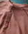 Refried Boogie, close-up of a brown shirt with a buttoned collar and detailed stitching.