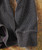 Shadows, close-up of fabric with fine, tiny checkered pattern and folded hem detailing.