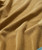 Steady Gettin' It, close-up of the soft, mustard-colored fabric of the clothing item.