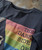 Spectrum T-shirt, casual black T-shirt with colorful rainbow-inspired graphic and text design.