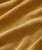 Soulshine, close-up of textured mustard yellow fabric with small woven pattern.