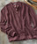 The Way It Goes men's textured maroon sweater with a Henley collar and three button placket.