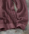 The Way It Goes, a pink textured knit sweater with a ribbed hem and intricate pattern.