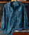 Enter The Jungle, men's tropical print button-up shirt featuring a vibrant jungle foliage pattern in shades of blue.