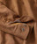 Shake My Tree, close-up of its brown fabric with detailed stitching and buttons, showcasing the quality and design of this product.