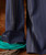 Trick Street, image of navy blue pants with detailed white and yellow decorative stitching on the side seams.
