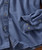 Boogie Bump, blue dress shirt with a small dotted pattern and buttoned cuffs.