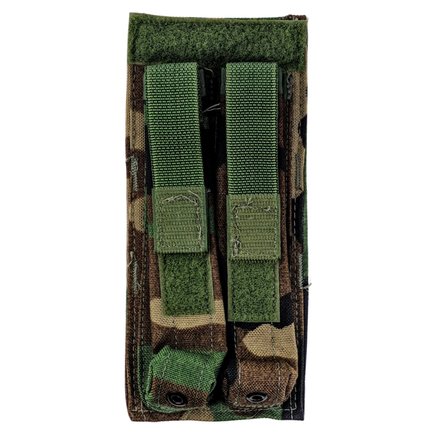 Front view of Specialty Defense Systems woodland camouflage double magazine pouch for HK MP5 with adjustable hook-and-loop retention flaps.
