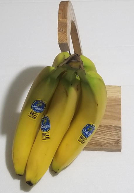 Wood banana holder hanger with metal hook main picture of item holding bananas