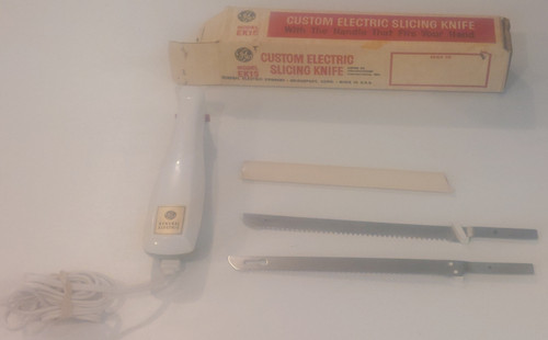 Electric slicing knife with box and everything shown.