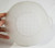 Frosted clear glass bowl with handles close view of the bottom pattern