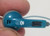Nintendo Gameboy Teal blue color headset Works close up top view of the earbud
