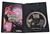Inside game case shown with instruction book and game disc shown