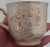 opposite side view of cup with stains shown