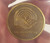 Close up of medal inside paperweight shown