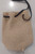Opposite side of purse shown when flat