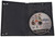 Inside game case shown with game disc