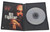 Inside DVD case shown with insert and full screen playing side shown
