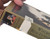 Side shown where damage was made from removing name and address label as mentioned.