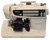 Sewing machine shown with power supply and pedal shown