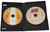Inside DVD case showing PC Disc on left and DVD on right
