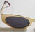 Gold frame retro 60s Hippie style Sunglasses New close up of left lense
