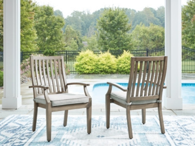 Ashley Rainier Ranch Brown Beige Outdoor Arm Chair with Cushion (Set of 2)