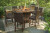Ashley Paradise Trail Medium Brown Outdoor Bar Table and 8 Barstools