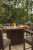 Ashley Paradise Trail Medium Brown Outdoor Bar Table and 8 Barstools