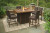 Ashley Paradise Trail Medium Brown Outdoor Bar Table and 6 Barstools