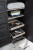 Ashley Foyland Black Brown California King Panel Storage Bed with Mirrored Dresser, Chest and Nightstand