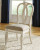 Ashley Realyn Chipped White 9-Piece Dining Set with Rectangular Table and 8 Ribbon Back Chairs