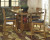 Ashley Ralene Medium Brown Counter Height Dining Table and 6 Barstools with Storage