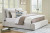 Ashley Cabalynn Light Brown California King Upholstered Bed with Mirrored Dresser, Chest and Nightstand