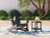 Ashley Sundown Treasure Black Outdoor Chair with End Table