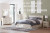 Ashley Lawroy Light Natural Queen Panel Bed with Mirrored Dresser and Chest