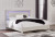 Ashley Zyniden Silver King Upholstered Panel Bed with Mirrored Dresser and 2 Nightstands
