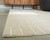 Ashley Wolbert Tan Ivory 5' x 7' Area Rug