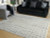 Ashley Turinwith Ivory Black 7'10" x 9'10" Area Rug