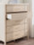 Ashley Cadmori Brown Queen Upholstered Panel Bed with Mirrored Dresser and Chest