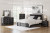 Ashley Birmonton Black Queen Upholstered Panel Storage Bed with Mirrored Dresser