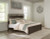 Ashley Covetown Dark Brown King Panel Bed with Mirrored Dresser, Chest and 2 Nightstands