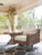 Ashley Beachcroft Beige Outdoor Swivel Lounge with Cushion